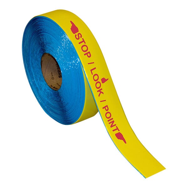 A roll of blue Superior Mark safety floor tape with red text reading "Stop Look Point" and yellow and red accents.