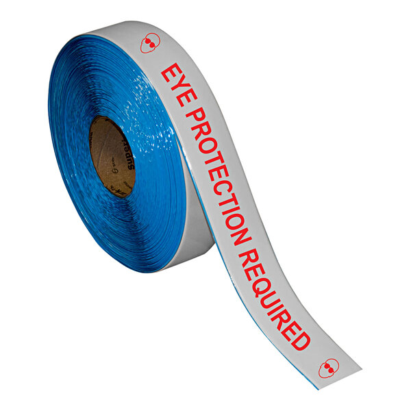 A roll of white and red safety tape with the words "Eye Protection Required" in red.