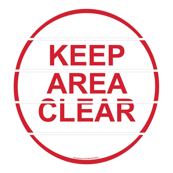 A red and white Superior Mark "Keep Area Clear" floor sign.