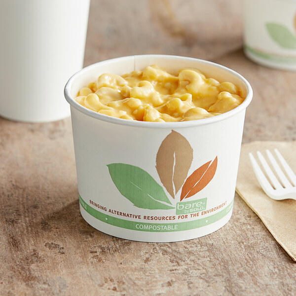 A Bare by Solo paper food cup with a bowl of macaroni and cheese on top.