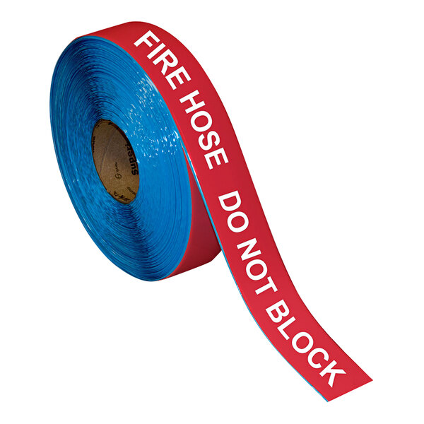 A roll of red and white Superior Mark safety tape with the words "Fire Hose Do Not Block" printed on it.