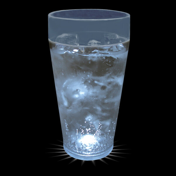 A 20 oz. plastic cup of ice water with a white LED light in it.