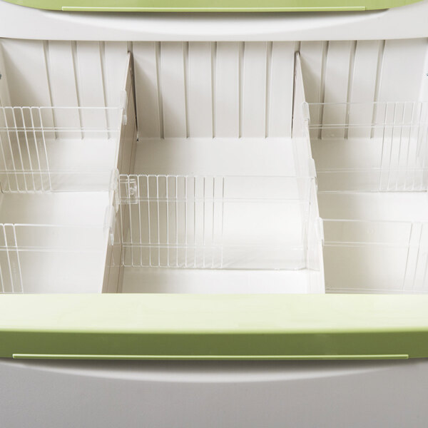 A white drawer with a green handle for a Metro Mini Bar Restocking Cart.
