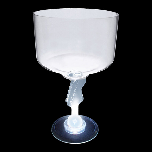 A clear plastic cup with a stem shaped like a guitar and a white LED light.