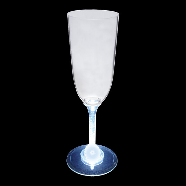 A clear plastic champagne cup with a white LED light in it.