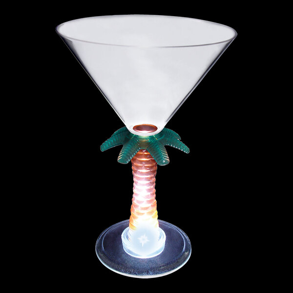A clear plastic martini glass with a palm tree stem and a white LED light.