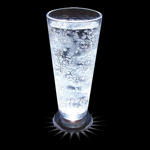 A customizable plastic pilsner cup with a white LED light filled with sparkling water and bubbles.