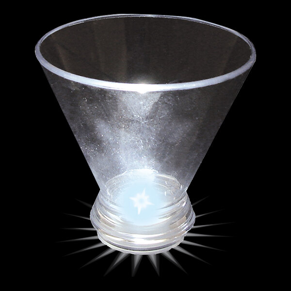 A clear plastic stemless martini cup with a white light inside.