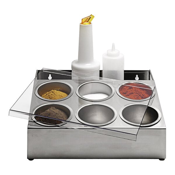 A Matfer Bourgeat stainless steel spice box with six compartments holding different condiments.
