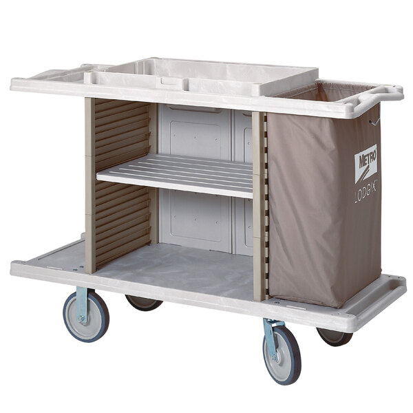 A white Metro Lodgix Essentials housekeeping cart with two shelves.