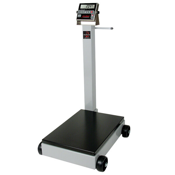 A black and grey Cardinal Detecto portable digital floor scale with a tower display.
