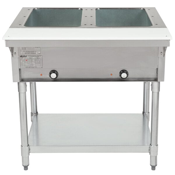 An Eagle Group stainless steel electric hot table with two rectangular wells on a counter.