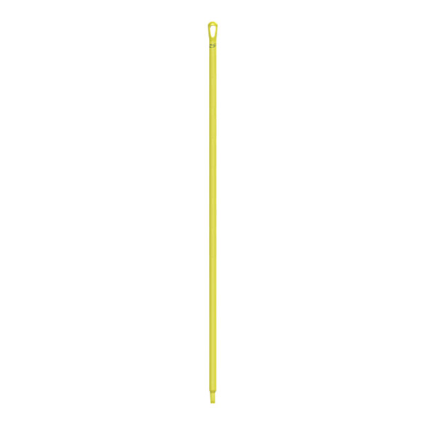 A yellow plastic stick with a hole.
