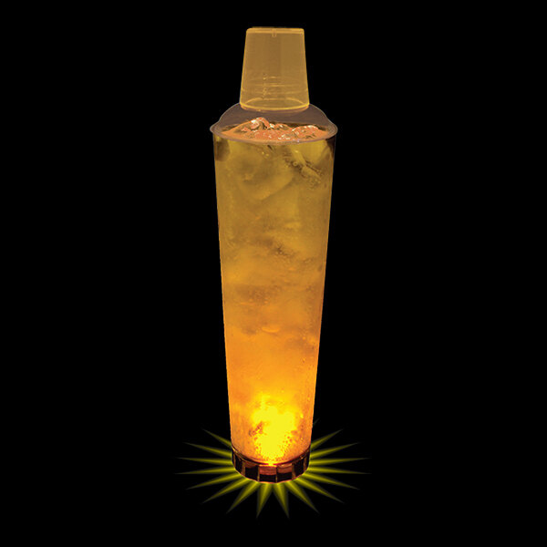 A 32 oz yellow LED lighted plastic shaker with ice and liquid inside.