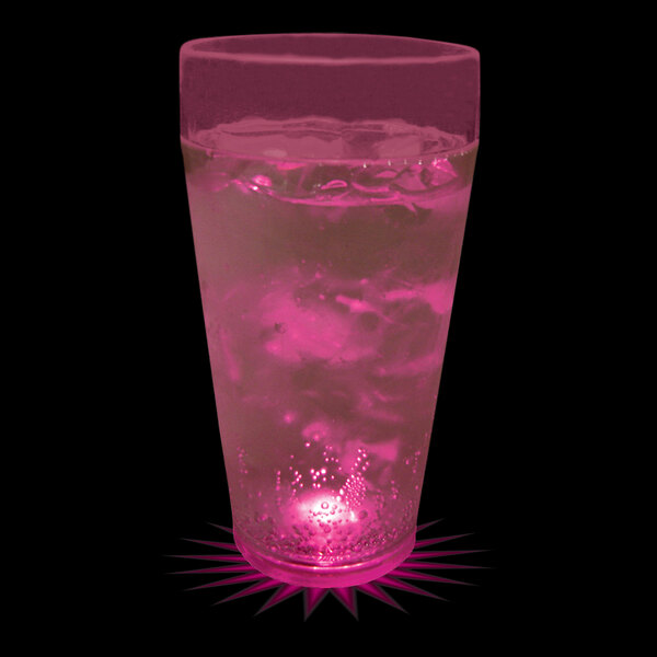 A 20 oz. plastic cup with pink liquid inside and a pink LED light.