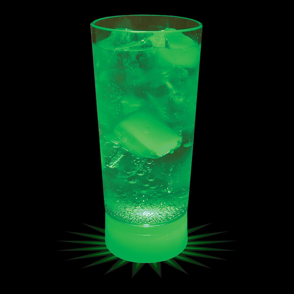 A 10 oz. customizable plastic cup with a green drink and ice cubes in it.