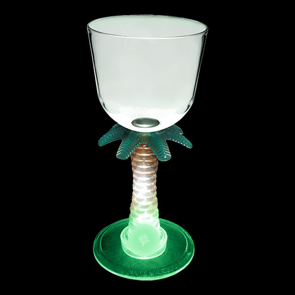 A clear plastic wine cup with a palm tree stem and a green LED light.