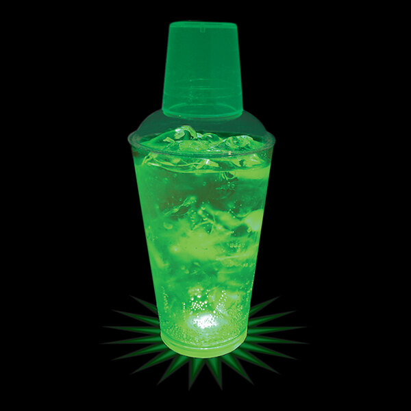 A green customizable plastic shaker with a green drink inside and ice.