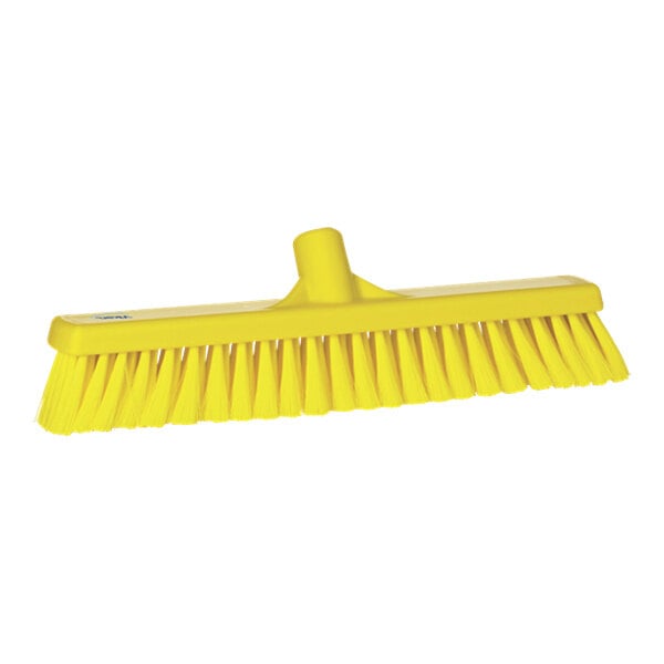 A yellow broom head with flagged bristles on a white background.