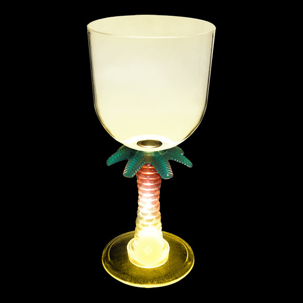 A clear plastic palm tree stem goblet with a yellow LED light inside.