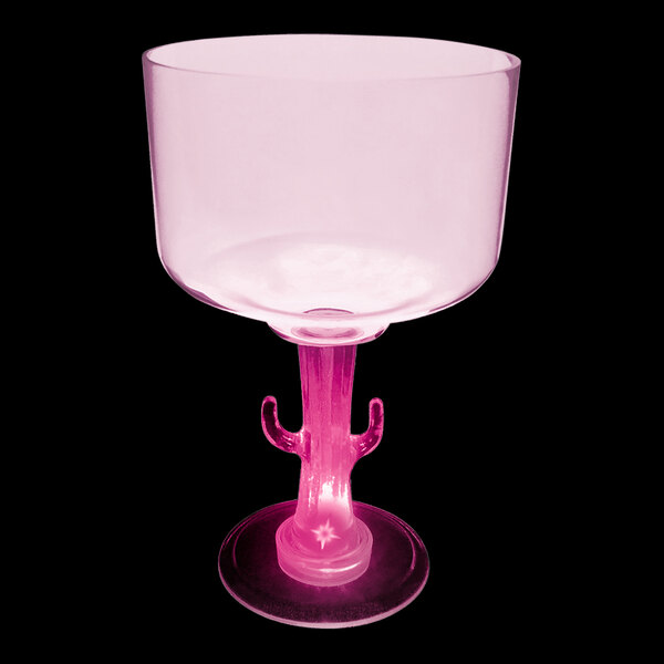 A white plastic margarita cup with a cactus stem and a pink LED light.