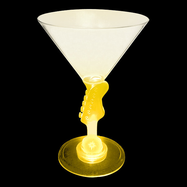 A yellow plastic guitar-shaped martini glass with a yellow LED light inside.