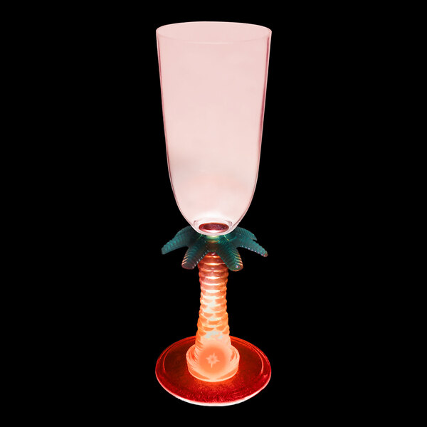 A customizable plastic champagne cup with a palm tree stem and a red LED light.