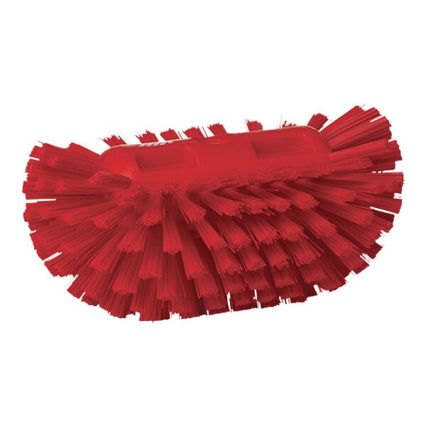 A red Vikan tank brush head with stiff bristles.