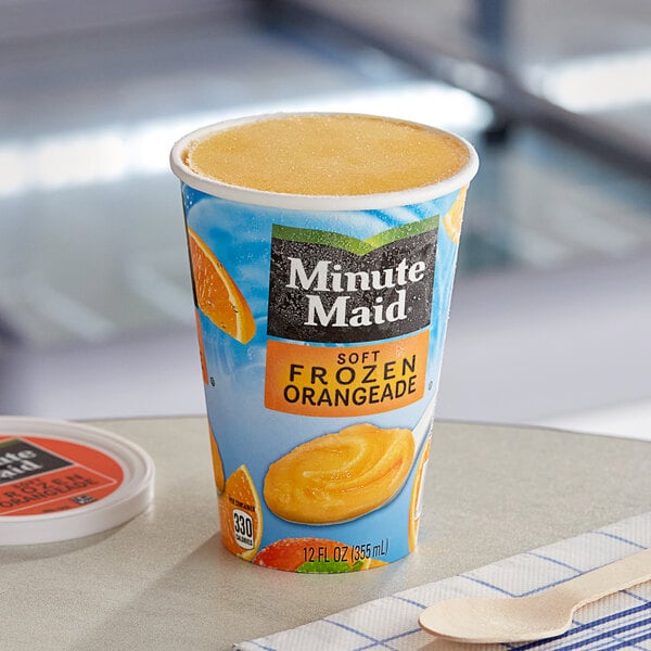 A close-up of a Minute Maid Soft Frozen Orangeade cup.