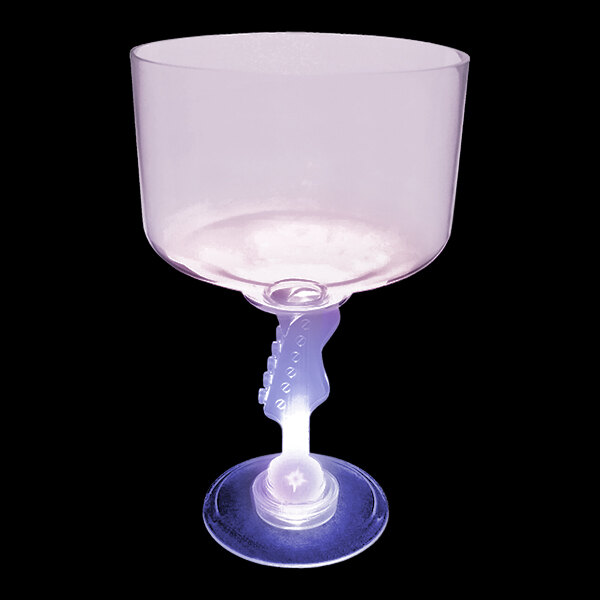 A clear plastic margarita cup with a purple LED lighted guitar stem.