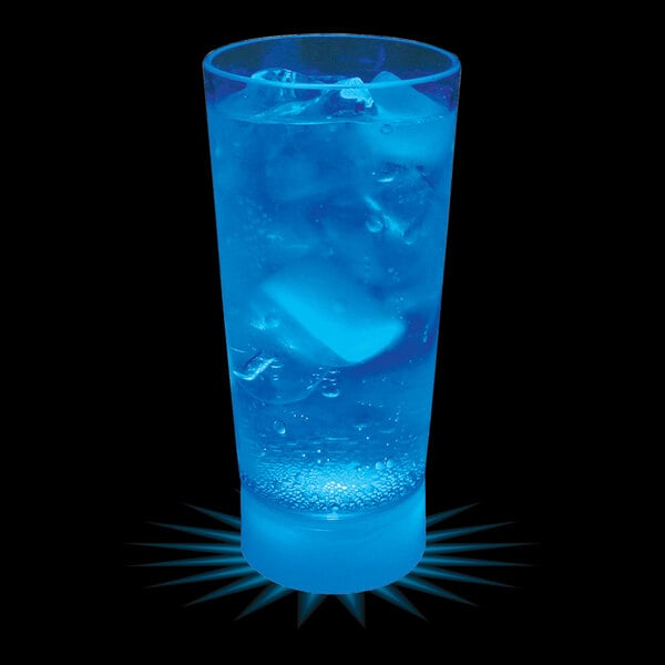 A customizable plastic cup with blue LED light filled with a blue drink and ice cubes on a table.
