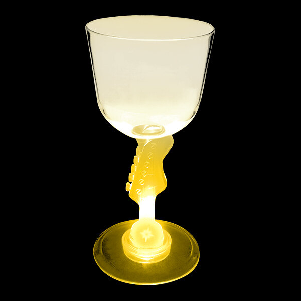 A close-up of a customizable plastic wine glass with a guitar-shaped stem and a yellow LED light inside.