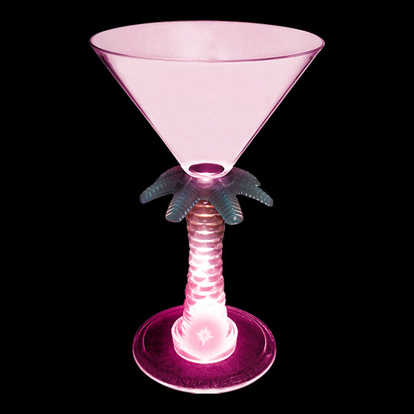 A pink plastic martini glass with a palm tree stem and a pink LED light.