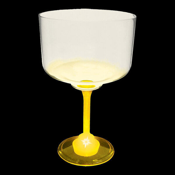 A customizable plastic margarita cup with a yellow stem and yellow LED light.