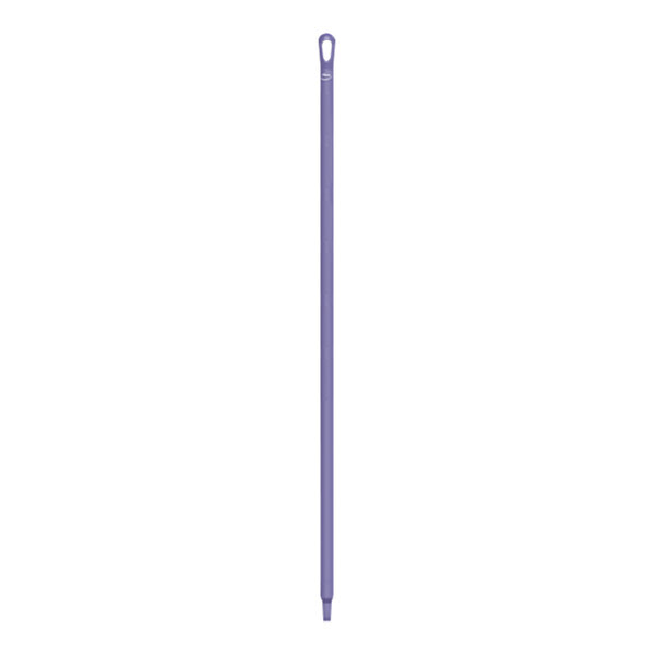 A purple plastic stick with a hole in the end.