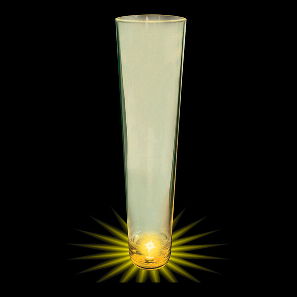 A tall plastic champagne shooter with a yellow LED light on the bottom.