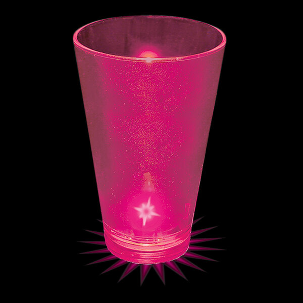 A pink plastic shot cup with a pink LED light inside.