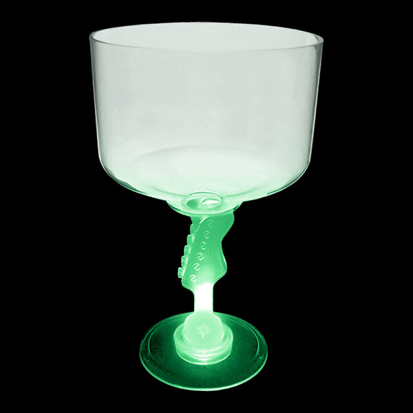 A close up of a customizable plastic guitar stem margarita cup with a green light inside.