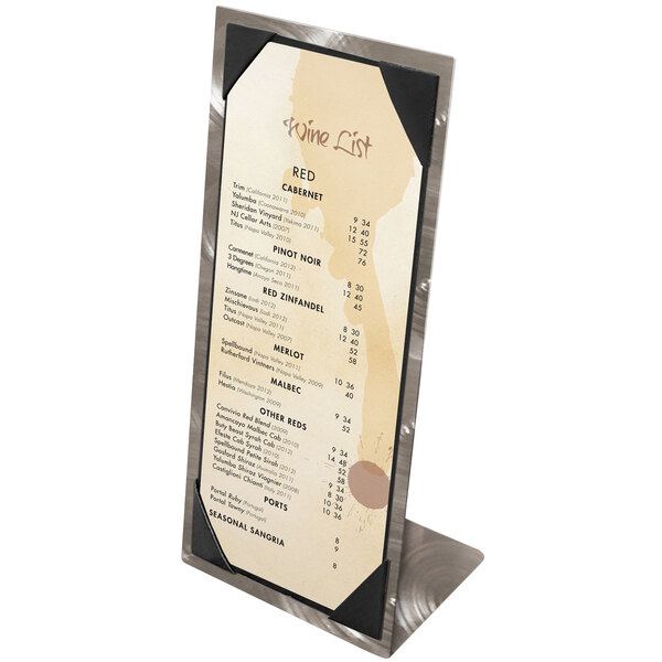 A Menu Solutions Alumitique aluminum table tent with swirl picture corners holding a menu on a stand with a white background.