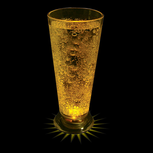 A customizable plastic pilsner cup filled with beer and a glowing yellow LED light.