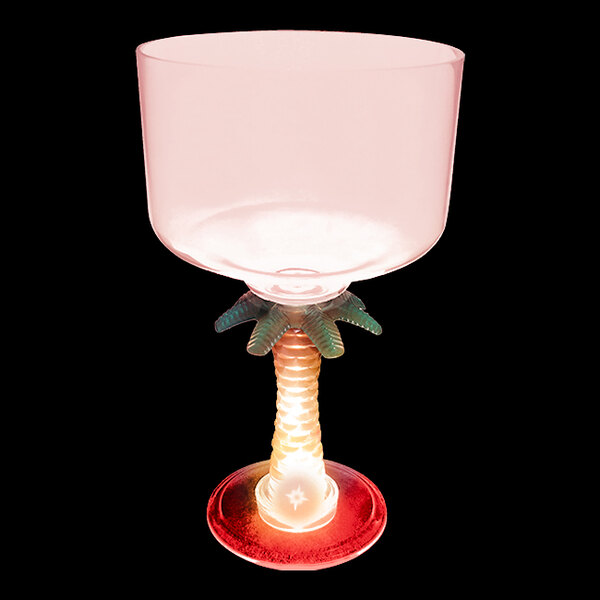 A clear plastic Palm Tree stem margarita cup with a red LED light.