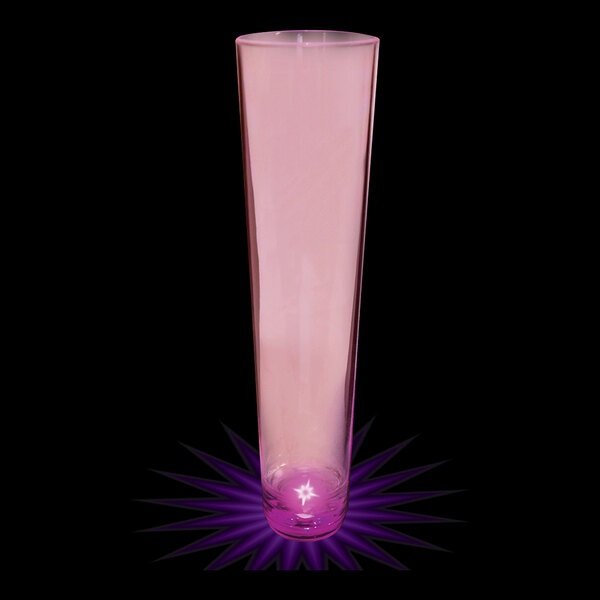 A 7 oz. plastic champagne shooter with purple LED light filled with pink liquid.