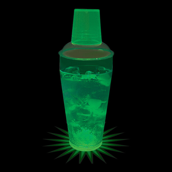 A 20 oz. customizable plastic shaker with a green LED light glowing in a green drink with ice.