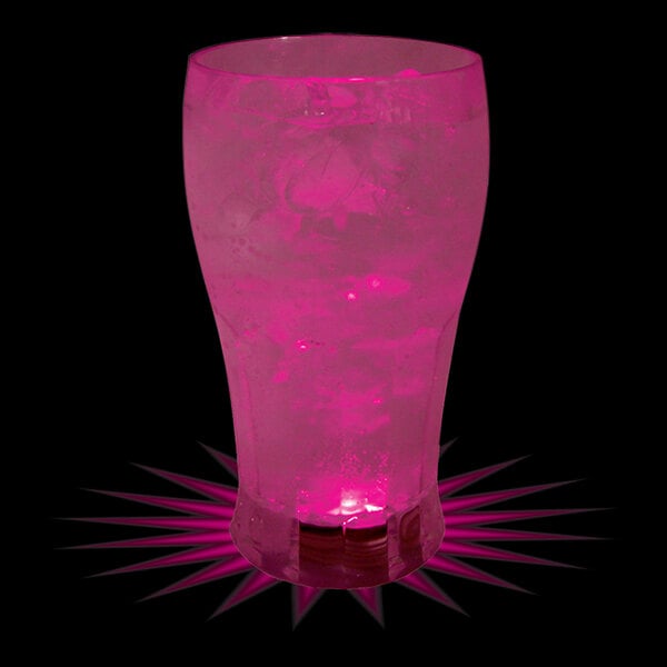 A customizable plastic soda cup with a pink LED light filled with a pink drink and ice.