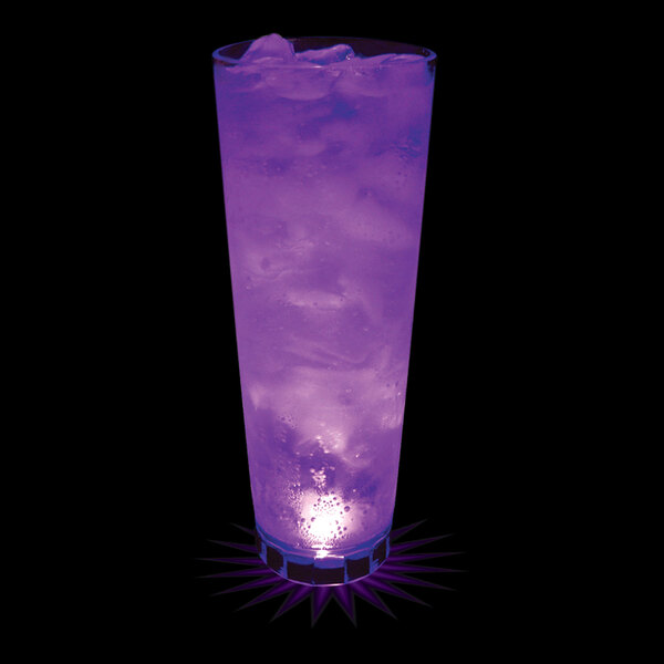 A clear plastic cup with a purple LED light filled with a purple drink.
