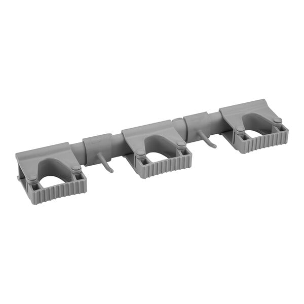 A set of three grey plastic Vikan wall brackets.