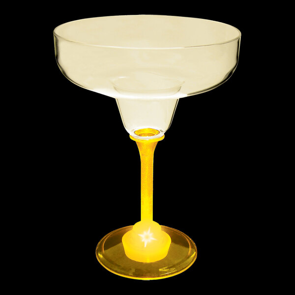 A 12 oz. plastic margarita glass with a yellow stem and LED light.