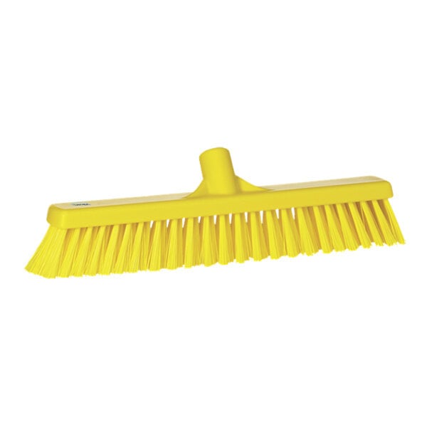 A yellow Vikan push broom head.