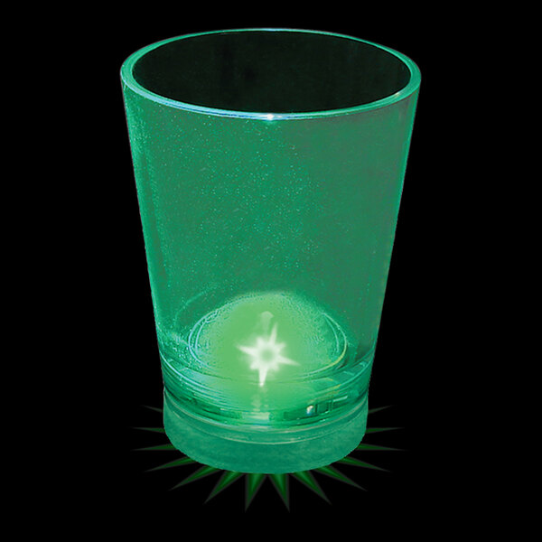 A green plastic shot cup with a green LED light inside.