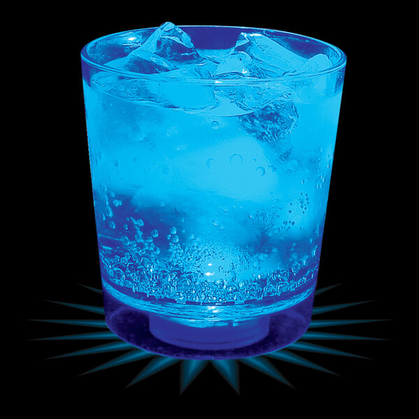 A customizable plastic rocks cup with a blue LED light filled with a drink and ice.